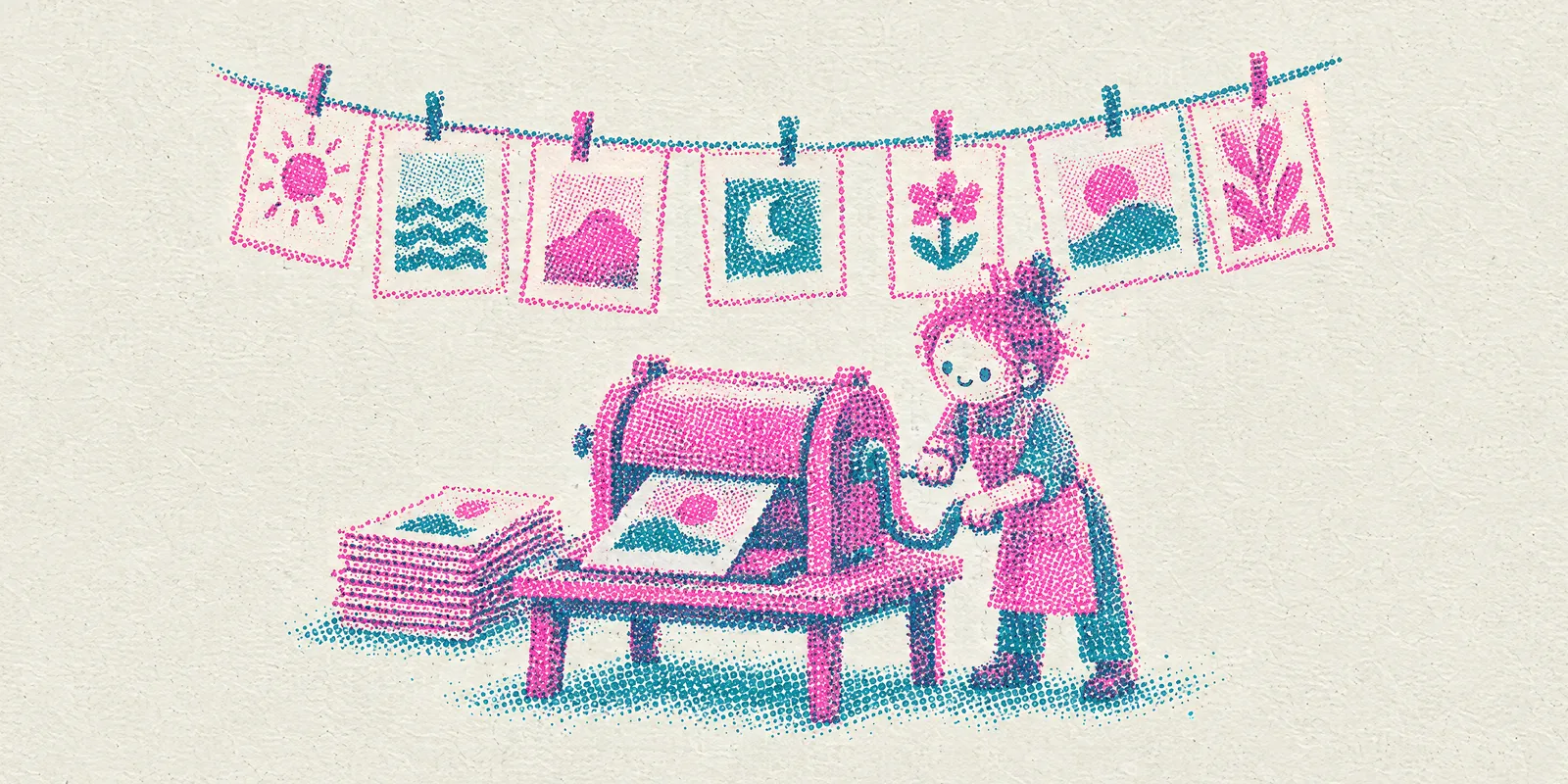 A small drum printing press: identical prints stack up on one side, many different prints dry on a clothesline above